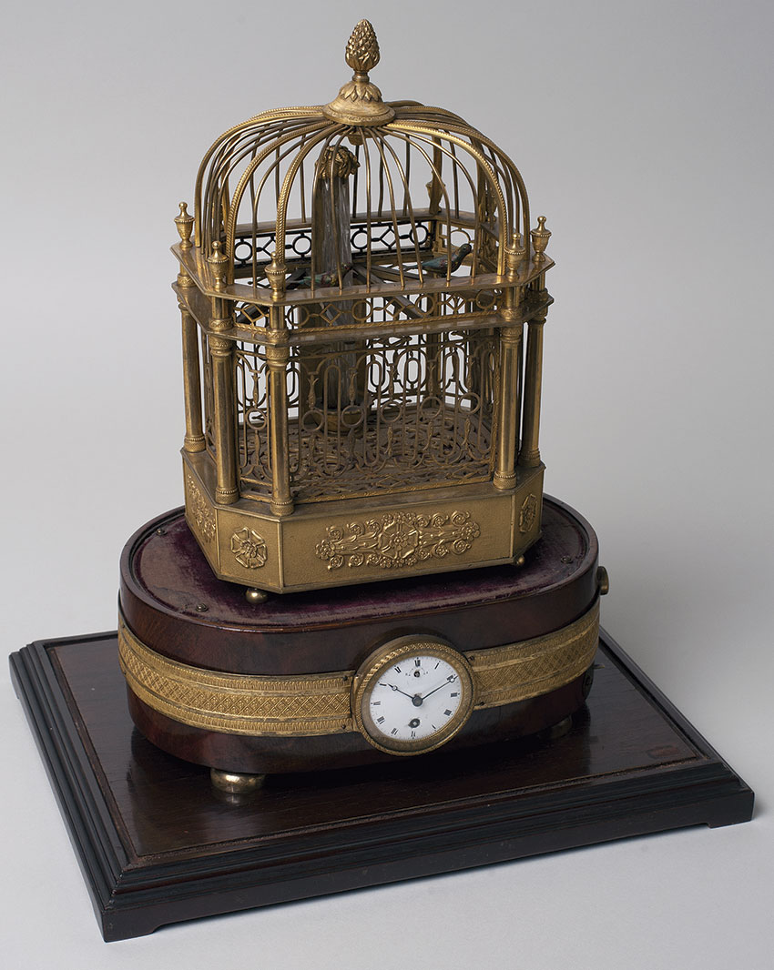 11 Reloj automata suizo. Jaula de pajaros por F. Nicole. Principios S. XIX. 37x34x15 cm. Nº Inv. P.O. 233